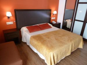 Voodi või voodid majutusasutuse Hotel Sesué toas