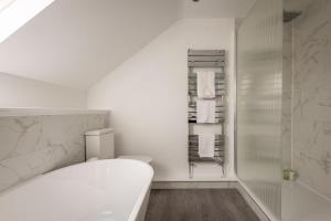 a white bathroom with a toilet and a shower at Rosemount - Kilrenny in Kilrenny +31 photos
