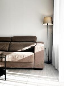 a living room with a couch and a lamp at Casa Relán by FTV HOLIDAYS HOMES in Villaverde +27 photos
