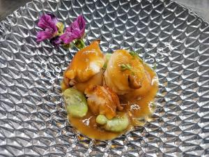 a plate with some food on it with flowers at ル カフェ プランタニエ in Yokote