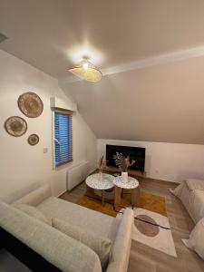a living room with a couch and a table at Résidences Eska in Bobigny