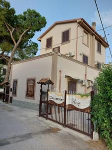 a house with a gate in front of it at Affittacamere Rosy in Foligno