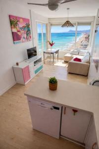 a living room with a view of the ocean at Un Rincon en el Mar in Bellreguart +26 photos