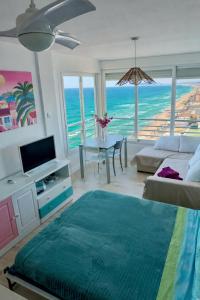 a living room with a view of the ocean at Un Rincon en el Mar in Bellreguart