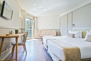 เตียงในห้องที่ Cullera Holiday