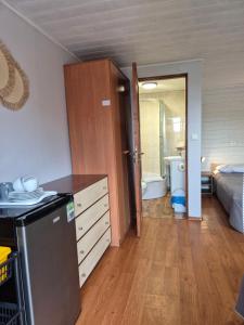 a room with a kitchen and a bathroom with a bed at Agroturystyka U BOŻENY in Przysłup +11 photos
