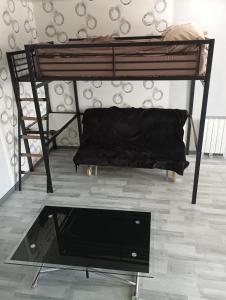 a black bunk bed in a room at le chêne in Créancey