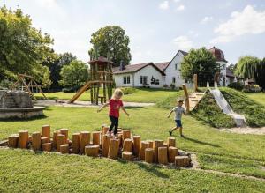 two children playing in a playground at Laasenhof in Struppen