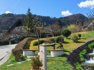 a garden in front of a house at ATMOSPHERE Apartments in Bled