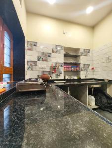 a kitchen with a counter and a counter top at Aura Villa in Delmāra +16 photos