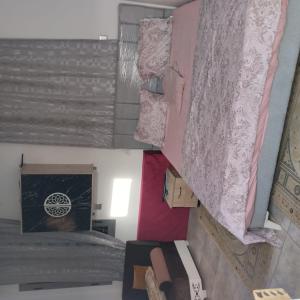 an overhead view of a room with curtains and a bed at Residence djerba 1 in Houmt Souk