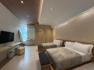 TV i/ili multimedijalni sistem u objektu Bespoke Hotel La Union