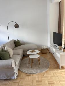 a living room with a couch and a table at Altstadtgold in Rostock