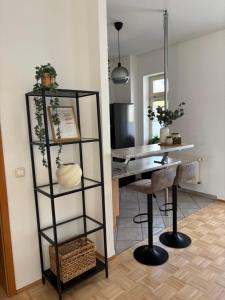 a room with a desk and a table and a chair at Altstadtgold in Rostock +8 photos