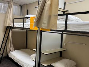 two bunk beds in a dorm room at Hostel City Center in Chişinău