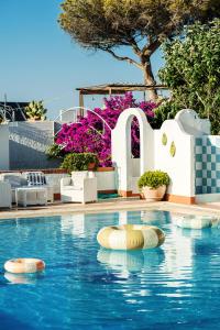 a swimming pool with buoys in the water at Paradise Relais Villa Janto' in Casamicciola Terme