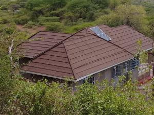 a house with a roof with a solar panel on it at Footprint Baringo in Marigat