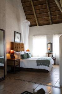 a bedroom with a large bed and a window at Elephants Footprint Lodge in Colchester +37 photos
