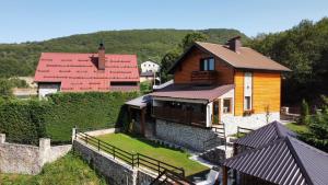 an aerial view of a house with a fence at Villa Beti in Mavrovo