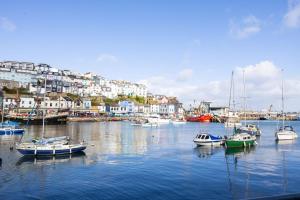 a group of boats docked in a harbor with buildings at Provident Suite - Free Wi-Fi - Sea View in Brixham +7 photos