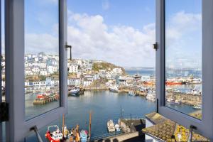 a view from a window of a harbor with boats at Provident Suite - Free Wi-Fi - Sea View in Brixham