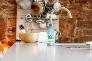 a bottle of evoc water sitting on a kitchen counter at Creewood - Elie in Elie +40 photos