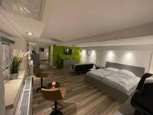 a bedroom with a bed and a living room at Haus Delphinen in Lübben +31 photos
