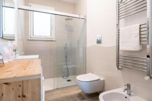 a bathroom with a shower and a toilet and a sink at Borgo Dei Cedri in Bari +44 photos