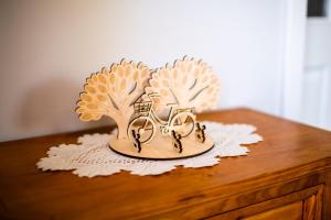 a wooden statue of trees on top of a table at Ferienwohnung Spreewaldglück in Burg