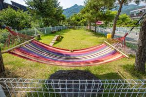 a hammock in the middle of a park at Glamdog - Gapyeong in Gapyeong