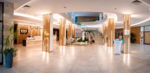 a lobby of a hospital with a hallway with columns at Mirabelle Hotel - All Inclusive - by Astoria Collection in Golden Sands