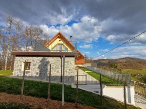 a stone house with a roof on top of it at Vineyard cottage Kraljevi kotiček in Trebnje