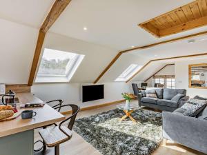 a living room with a couch and a tv at 1 Bed in Launceston oc-86674 in North Petherwin