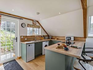 a kitchen with a sink and a dishwasher at 1 Bed in Launceston oc-86674 in North Petherwin