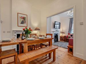 a dining room with a table and a living room at 3 Bed in Newquay oc-53688 in Newquay