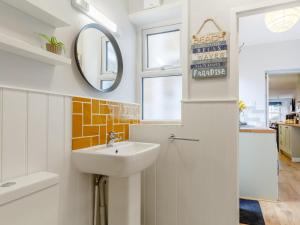 a bathroom with a sink and a mirror at 2 Bed in Polruan oc-82949 in Fowey +16 photos