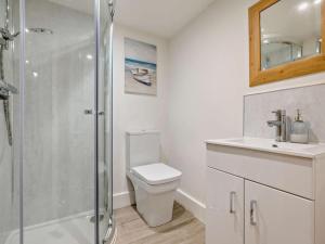 a bathroom with a shower and a toilet and a sink at 2 Bed in Wadebridge oc-83130 in Little Petherick +8 photos