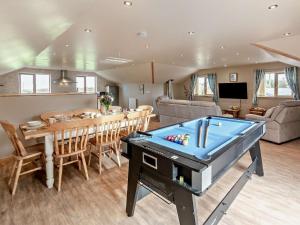 a living room with a pool table and a dining room at 4 Bed in Newquay oc-56747 in Cubert