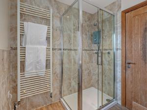 a shower with a glass door in a bathroom at 4 Bed in Newquay oc-56747 in Cubert +22 photos