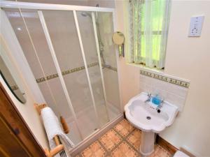 a bathroom with a shower and a sink at 1 Bed in Liskeard oc-nutha in Warleggan +12 photos