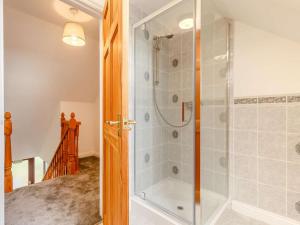 a bathroom with a shower with a glass door at 4 Bed in Bodmin oc-88543 in Bodmin +20 photos