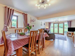 a kitchen and dining room with a table and chairs at 3 Bed in Launceston oc-oldoa in North Hill
