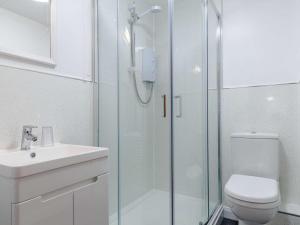 a bathroom with a shower and a toilet and a sink at 2 Bed in St. Austell oc-82609 in St Austell +7 photos