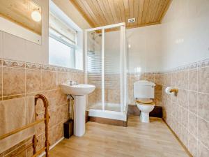 a bathroom with a shower and a toilet and a sink at 3 Bed in Padstow oc-treba in Saint Merryn +23 photos