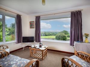 a living room with a large window at 2 Bed in Falmouth oc-tvean in Constantine
