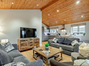 a living room with couches and a flat screen tv at 3 Bed in St. Columb oc-43079 in Saint Columb Major