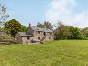 an old stone house with a field in front of it at 3 Bed in Hayle oc-78551 in Hayle