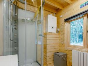 a bathroom with a shower in a wooden house at 2 Bed in Holsworthy oc-87766 in Week Saint Mary +11 photos