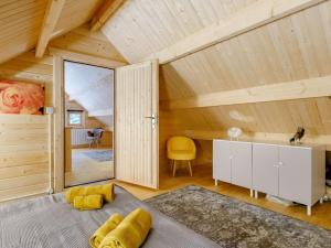 an attic room with a large window and a desk at 2 Bed in Holsworthy oc-87766 in Week Saint Mary