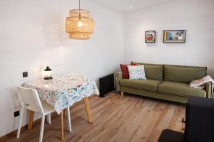 a living room with a table and a couch at Lavochne Villas in Stantsiya Lavochne +25 photos